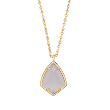 A gold chain necklace with a geometric, faceted white stone pendant enclosed in a thin gold border.