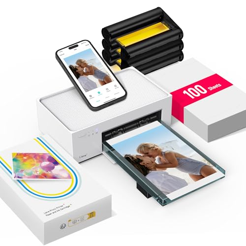A smartphone-controlled photo printer is shown with a printed photo, 100 sheets of photo paper, and ink cartridges.