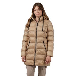 A woman is wearing a beige puffer coat with a hood and zipper closure. The coat has side pockets with zippers and is styled with beige trousers.