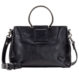 A black leather handbag with circular metal handles and a detachable shoulder strap, featuring a small embossed floral detail.