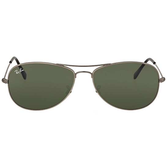 Ray-Ban Cockpit Aviator Sunglasses feature a sleek gunmetal frame, green lenses, and the iconic Ray-Ban logo on the left lens. They have a double bridge and thin temples for a classic aviator look.