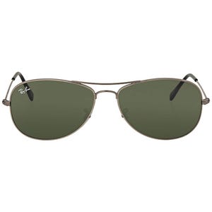 Ray-Ban Cockpit Aviator Sunglasses feature a sleek gunmetal frame, green lenses, and the iconic Ray-Ban logo on the left lens. They have a double bridge and thin temples for a classic aviator look.