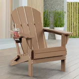 Tan Adirondack chair with a cup holder, featuring a glass of lemonade. It's situated on a patio with potted plants in the background.