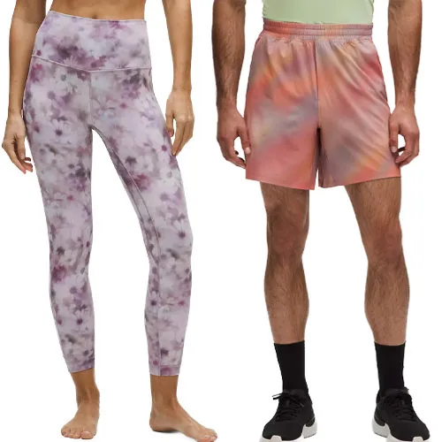Two pieces of tie-dye activewear: a pair of purple and white leggings and orange-pink shorts, both designed for comfort and flexibility.