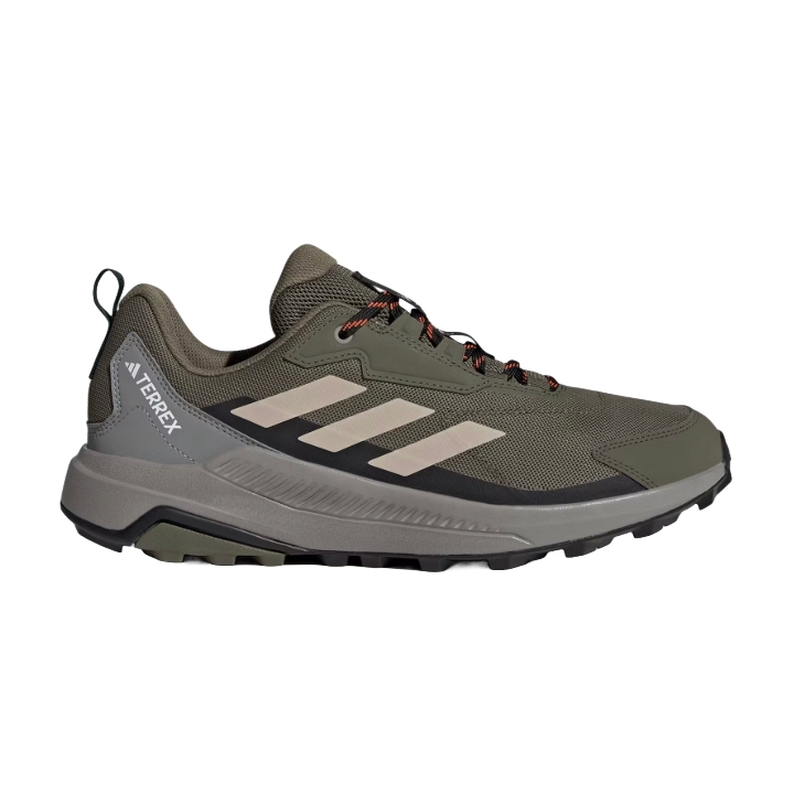 A green Adidas Terrex hiking shoe featuring a rugged design with three stripes on the side and a durable sole.