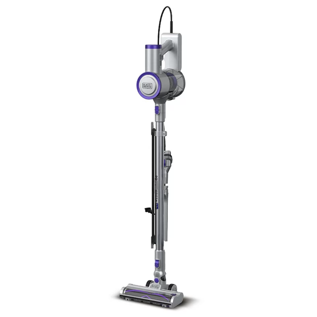 A Black+Decker cordless stick vacuum cleaner with a slim, lightweight design, featuring a wall-mounted charging dock and an elongated cleaning wand.