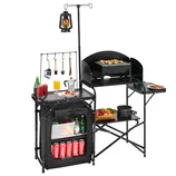 A portable outdoor camping kitchen with a foldable structure, features a grill station, storage shelves with a zippered cover, utensil hooks, and a lantern pole. It includes spaces for drinks, utensils, and food preparation.
