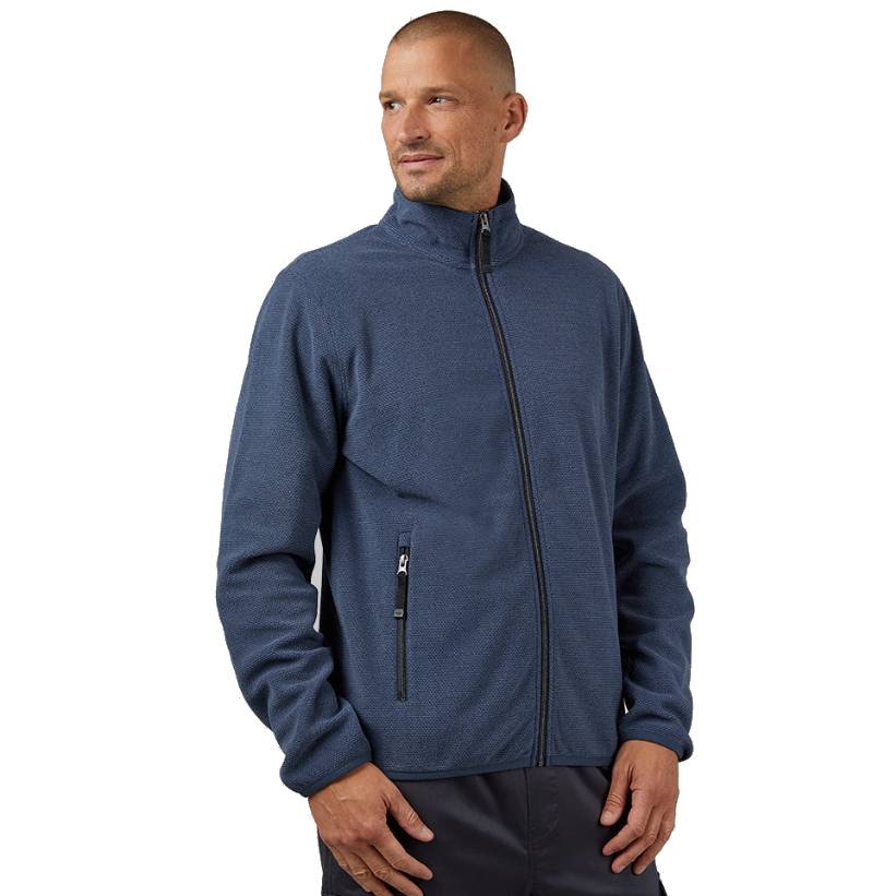 A man is wearing a blue fleece jacket with a high collar, full-zip front, and a zippered pocket on the chest.