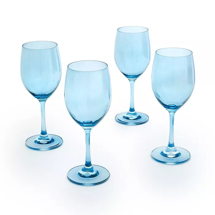 Four light blue wine glasses with sleek, elegant stems designed for white wine. They have a classic shape and each glass rests on a wide, stable base.