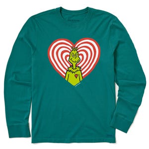 Teal long-sleeve shirt featuring the Grinch inside a red and white heart design. The words \“Life is Good\“ are subtly visible on the shirt.