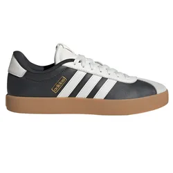 Black and white Adidas sneaker with three white stripes, a brown gum sole, and a gold Adidas logo on the side.