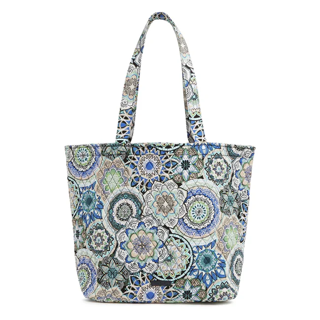 A tote bag with a colorful mandala pattern.