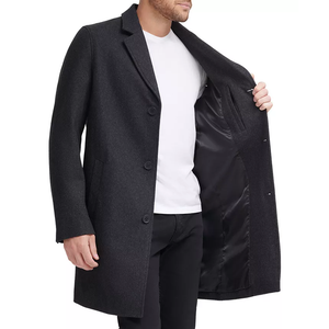 Cole Haan Melton Classic-Fit Topcoat is a charcoal, single-breasted coat with a smooth, black inner lining. It features three buttons and notched lapels, offering a sleek, timeless look.