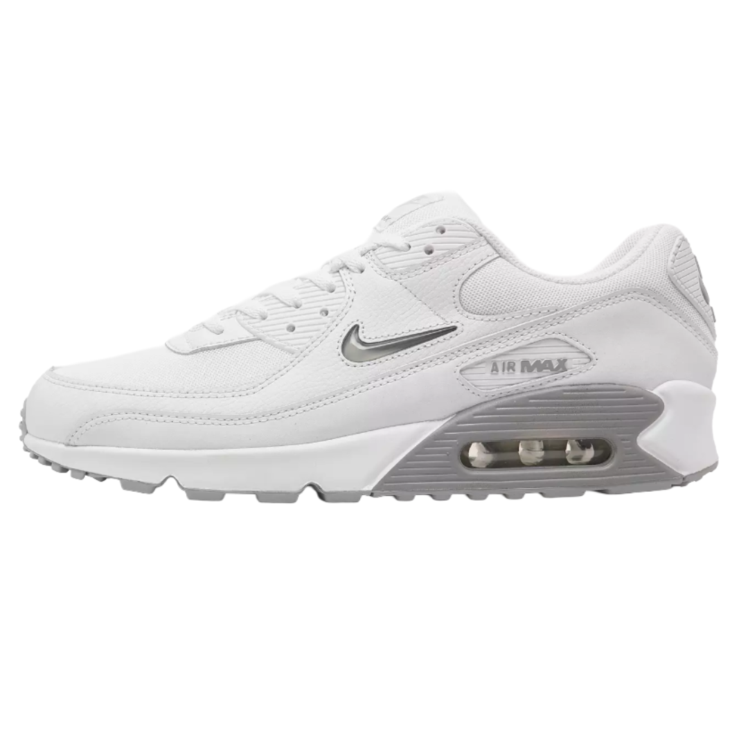 Nike Air Max 90 white sneaker with a visible air unit, featuring a white and gray color scheme and a swoosh logo on the side.