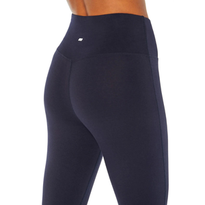 Navy blue leggings with a high waist and a small logo on the hip.