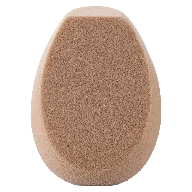 A beige, oval-shaped makeup sponge with a flat edge, used for blending foundation and other cosmetics for a smooth application.