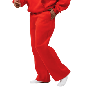 A person is wearing a bright red sweatshirt and matching sweatpants, standing with one hand in the pocket and wearing white socks.