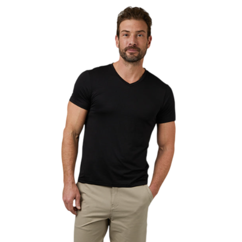 A man wears a fitted black V-neck t-shirt and beige knee-length shorts.