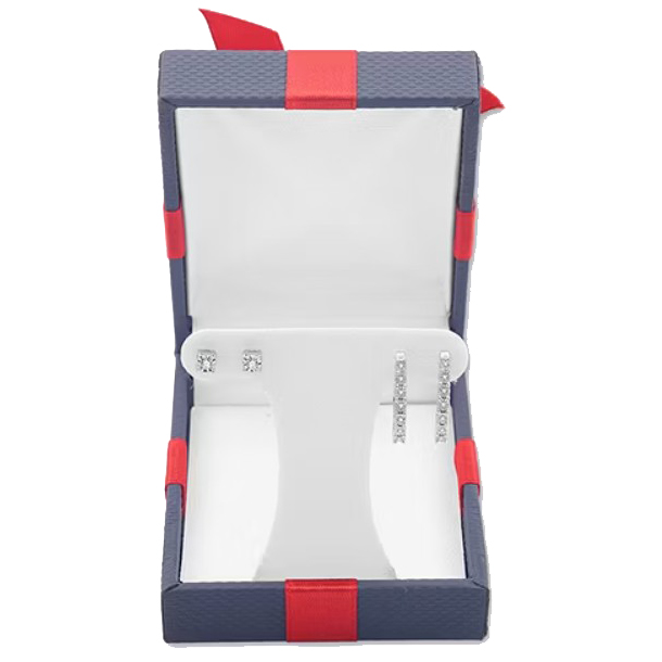 A pair of stud earrings and a pair of vertically aligned drop earrings with gemstones are displayed in an open navy and red jewelry box.