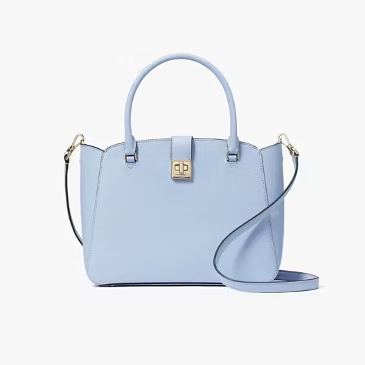 A pale blue handbag with a top handle, a front clasp, and a detachable shoulder strap.