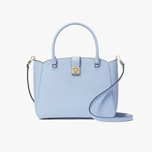 A pale blue handbag with a top handle, a front clasp, and a detachable shoulder strap.