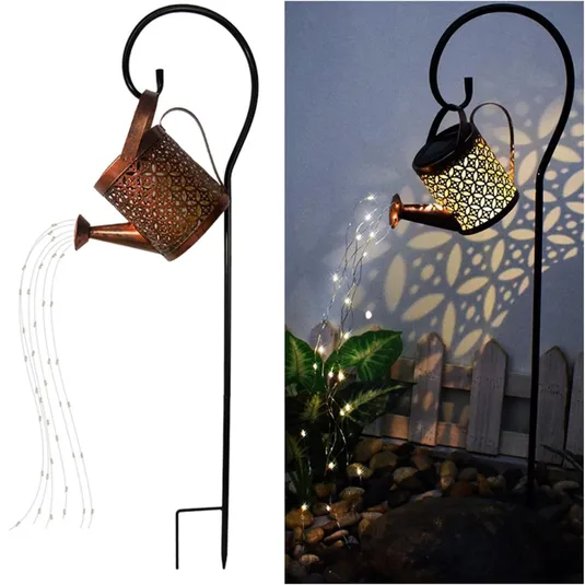 Decorative solar watering can lights with LED string lights, featuring a floral cutout design that casts intricate shadows when illuminated. Ideal for garden or outdoor decor.