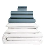 A stacked set of bedding items, including dark-colored sheets, pillowcases, and white pillows with a comforter.