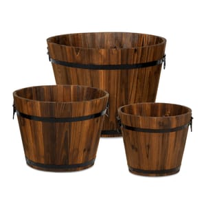 Three varying sizes of wooden buckets with black metal bands.