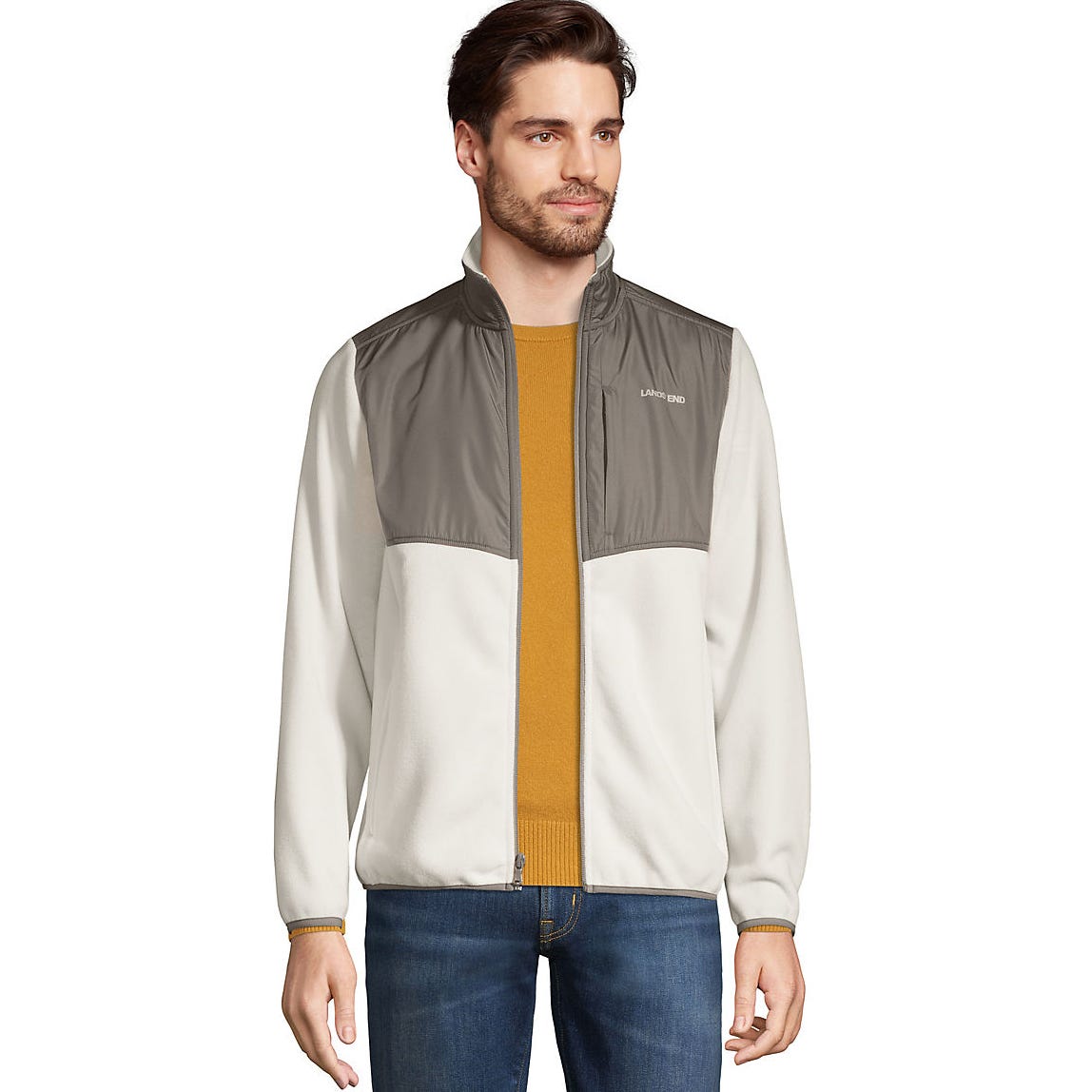 Man wearing a color-blocked bomber jacket with a zipper front and ribbed cuffs.