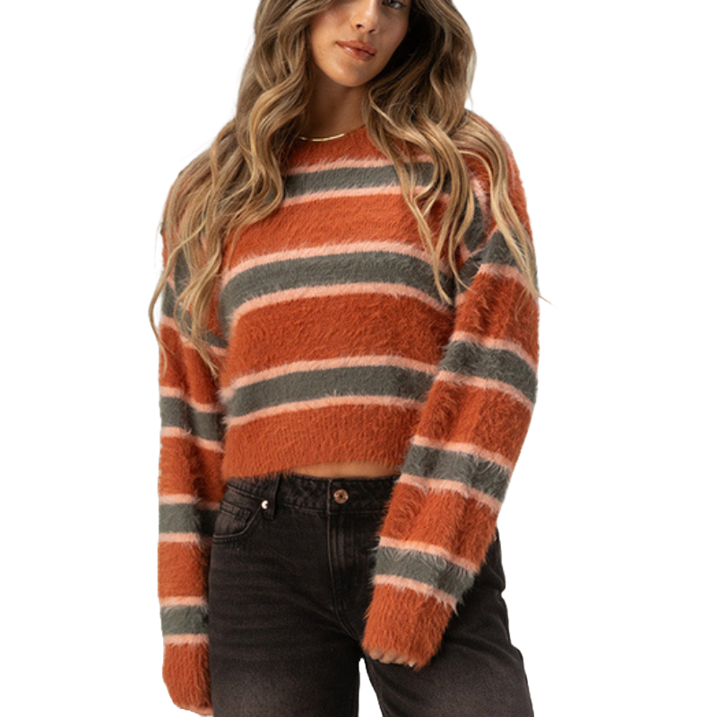 A cozy, long-sleeve sweater with fuzzy fabric in bold horizontal stripes of orange, gray, and light pink, featuring a cropped fit.