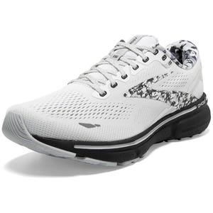 White Brooks Women's Ghost 15 running shoes with a patterned design on the sides, mesh upper for breathability, cushioned sole for comfort, and lace-up closure.