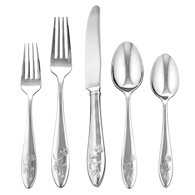 A set of five stainless steel utensils featuring a dinner fork, salad fork, knife, tablespoon, and teaspoon, each with a floral motif engraved on the handles.