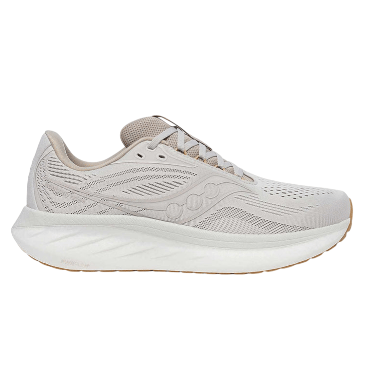 A beige Saucony running shoe featuring a breathable mesh upper, distinctive logo design, and a cushioned, thick white sole with gum outsole accents.