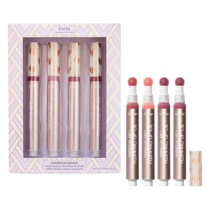 Tarte Maracuja Juicy Plumping Lip Oil set includes four shades with a sponge applicator in a decorative box labeled \“Mistletoe Kisses.\“