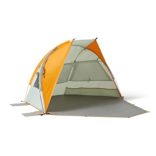 A compact, dome-shaped, orange and gray beach or camping tent with a partially open front and an extended ground tarp for extra space and protection.