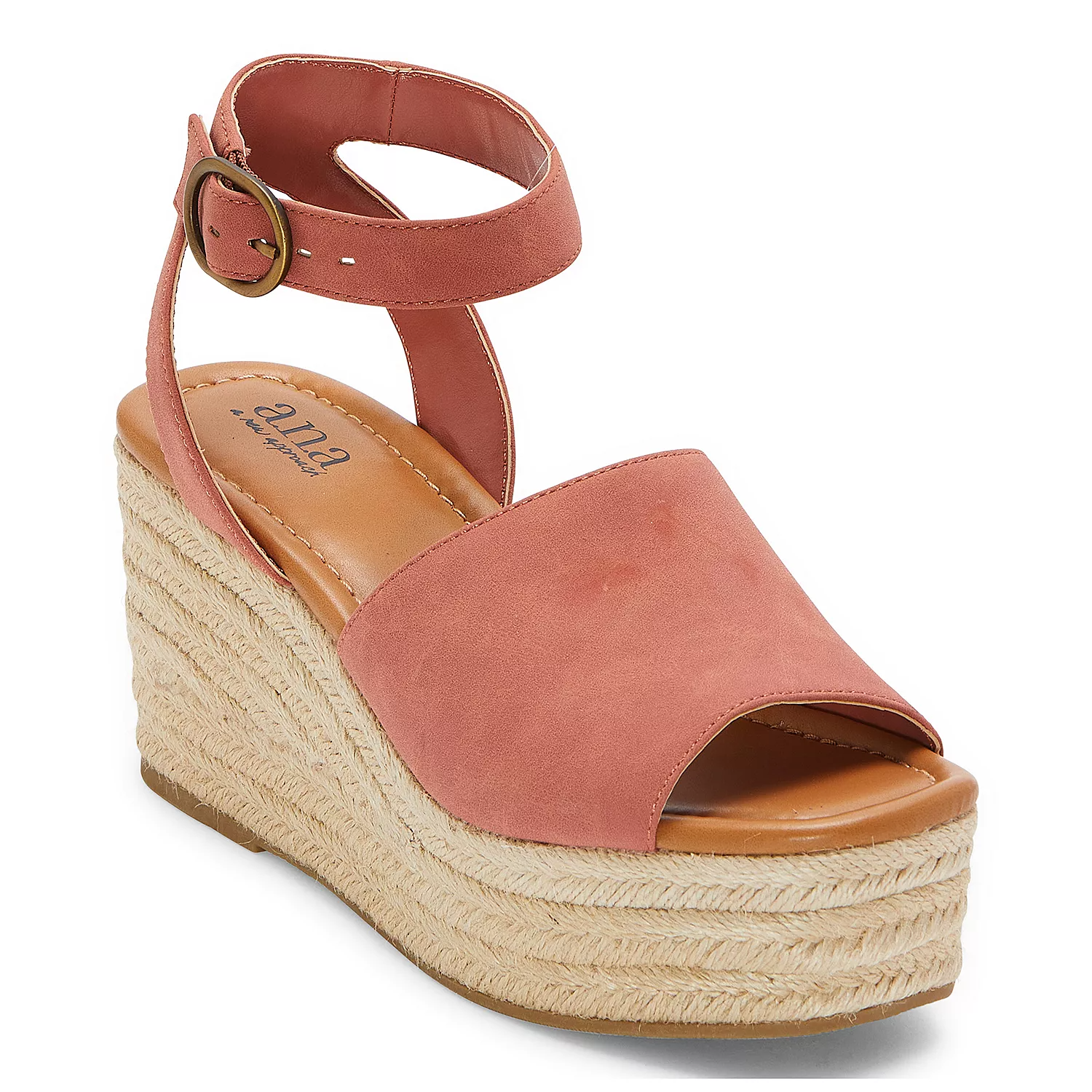 A pink women's espadrille wedge sandal with a strap around the ankle.
