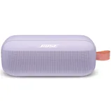 A lavender Bose Bluetooth speaker with an orange carrying strap, featuring a perforated front for sound and minimalistic top controls.