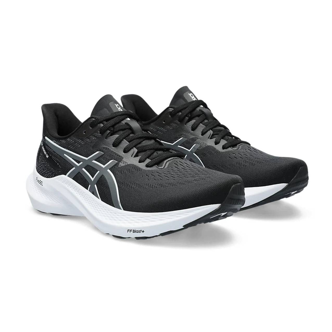 A pair of black and white ASICS running shoes with the FF BLAST+ cushioning system visible on the sole.