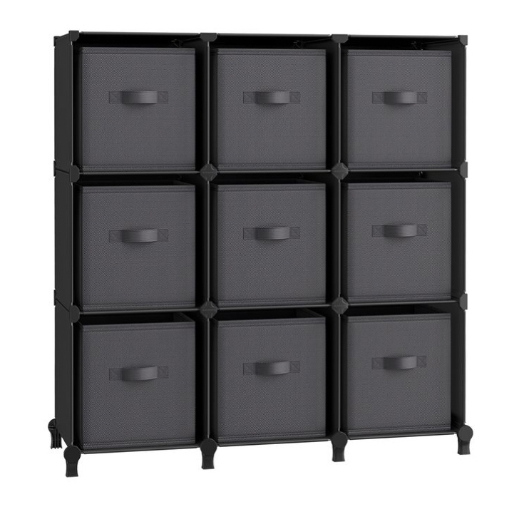 A modular storage unit with nine square cubbies, each containing a black fabric drawer with a handle, arranged in a 3x3 grid. Suitable for organizing various items.