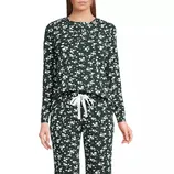 Two-piece loungewear set with a dark base and small white floral pattern, featuring a long-sleeve top and drawstring pants.