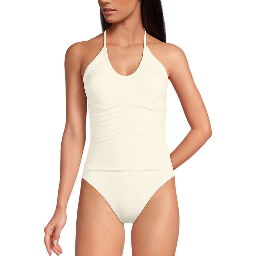 One-piece off-white swimsuit with halter-neck ties and ruched detailing in the front.
