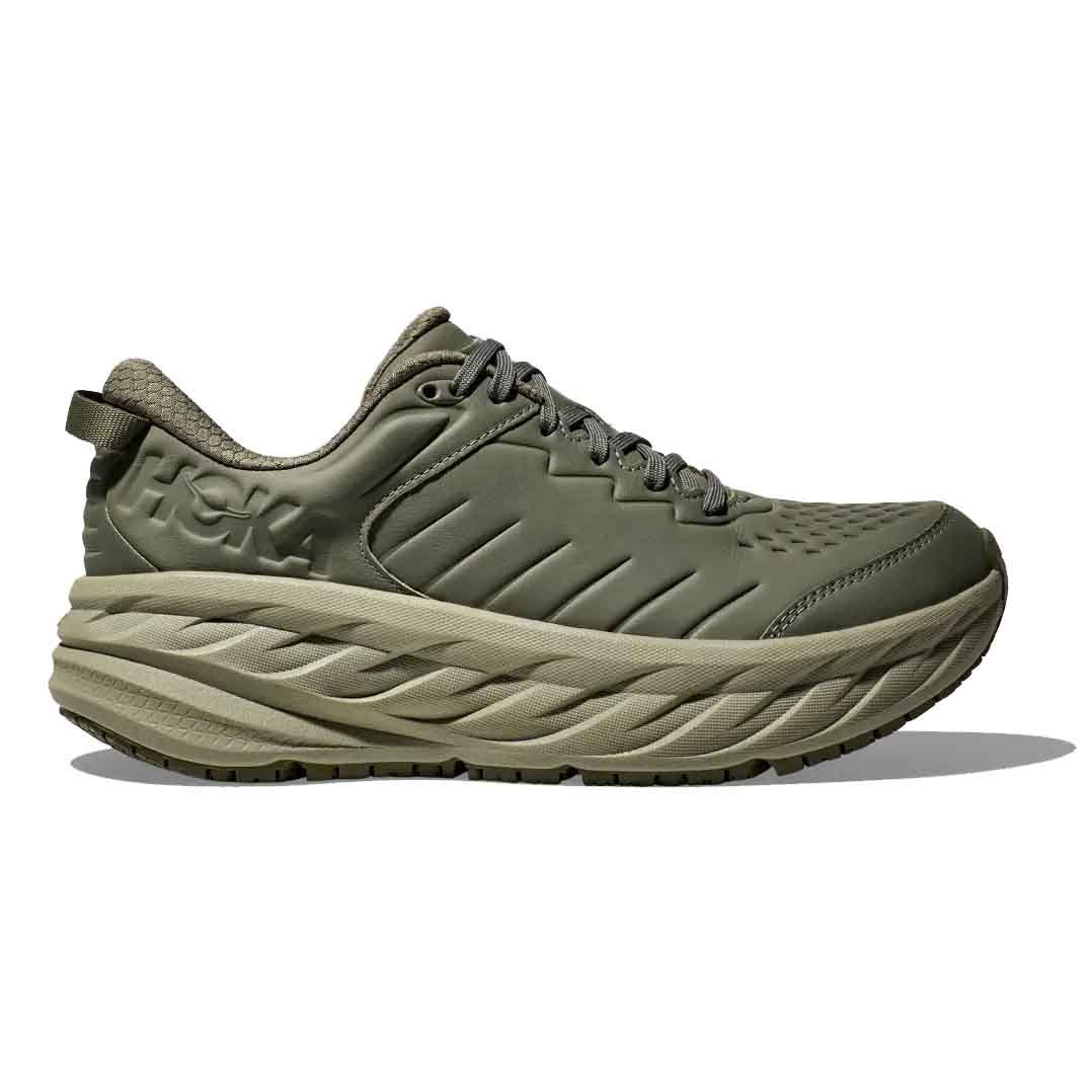 Hoka Men's Bondi SR Shoes feature a thick, cushioned sole and a leather upper in an olive color. They are designed for comfort and support in work environments, emphasizing durability and slip-resistant outsoles.