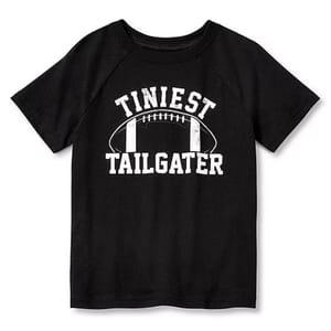 Black T-shirt with the text \“Tiniest Tailgater\“ and a football graphic in white.