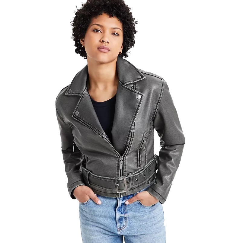 A person is wearing a black leather jacket with a zipper and belt detailing, paired with light blue jeans.