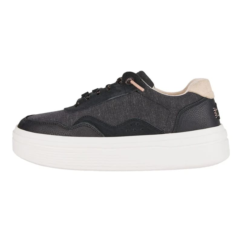 Black and beige platform sneaker with a white sole.