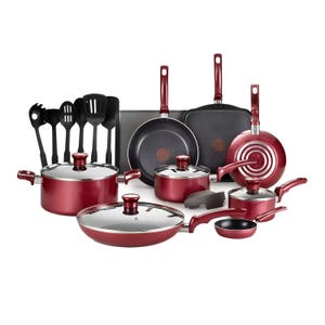 The 20-piece T-Fal Cookware Set includes a variety of nonstick pots, pans, and cooking utensils in a deep red color. The set features different sizes of saucepans, fry pans, a Dutch oven, baking sheets, and several black cooking tools.