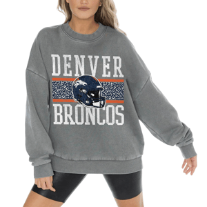 A gray oversized sweatshirt featuring \“Denver Broncos\“ text, a blue helmet with the team's logo, and an orange and blue patterned stripe across the chest.
