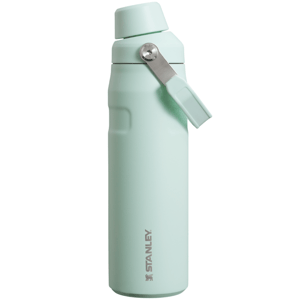 A light green Stanley water bottle with a flip top handle and a sleek, ergonomic design.