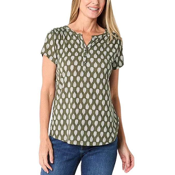 Liz Claiborne Split-Neck Short-Sleeve Top features an olive green fabric with a white geometric leaf pattern, short sleeves, and a split neckline. The top is paired with jeans and presents a casual, comfortable style.