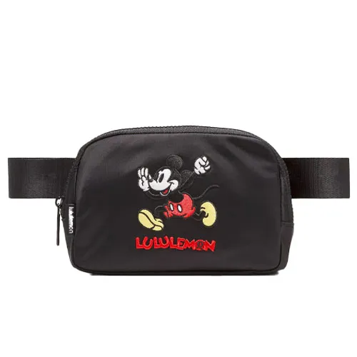 A black Lululemon belt bag featuring an embroidered Mickey Mouse design and the Lululemon logo.